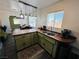Open-concept kitchen with stainless steel sink, modern countertops, and view to the dining area at 378 W Thomas Ave, Overton, NV 89040