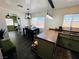 Open-concept kitchen and dining area with modern lighting, countertops, and dark vinyl floors at 378 W Thomas Ave, Overton, NV 89040