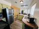 Open kitchen and dining area featuring updated countertops, lighting, and stainless steel appliances at 378 W Thomas Ave, Overton, NV 89040