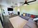 Bright living room with a large sectional sofa, TV and stylish decor at 378 W Thomas Ave, Overton, NV 89040