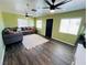 Inviting living room with a large sectional, dark wood floors, and lots of light at 378 W Thomas Ave, Overton, NV 89040