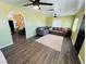 Open living space with wood-look flooring, neutral rug, and comfortable seating at 378 W Thomas Ave, Overton, NV 89040