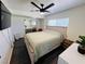 This is the main bedroom featuring a modern ceiling fan and a large bed at 378 W Thomas Ave, Overton, NV 89040