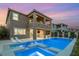 This luxury home boasts a beautiful pool, spa, tanning deck and water feature in backyard at 390 Coastal Redwood St, Las Vegas, NV 89138