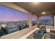 Relaxing balcony with comfortable seating and picturesque mountain views at 390 Coastal Redwood St, Las Vegas, NV 89138