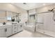 Bright bathroom features a double sink vanity, separate shower and tub, and plenty of natural light from large windows at 390 Coastal Redwood St, Las Vegas, NV 89138