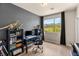 The bedroom features a workspace with a large window, allowing natural light to fill the room for increased productivity at 390 Coastal Redwood St, Las Vegas, NV 89138