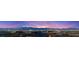 Panoramic city views featuring the Las Vegas Strip and distant mountains at twilight at 390 Coastal Redwood St, Las Vegas, NV 89138