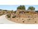 Stone community entrance with meticulously maintained landscaping and signage at 390 Coastal Redwood St, Las Vegas, NV 89138