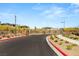 Gated community entrance with lush landscaping, creating a welcoming arrival experience at 390 Coastal Redwood St, Las Vegas, NV 89138