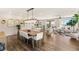 Spacious living room with hardwood floors, a large dining table, and plenty of natural light at 390 Coastal Redwood St, Las Vegas, NV 89138