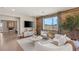 Bright living space featuring wood accent wall, TV, mountain views, and modern furniture at 390 Coastal Redwood St, Las Vegas, NV 89138