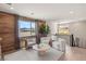 Bright living space featuring wood accent wall, mountain views, and modern furniture at 390 Coastal Redwood St, Las Vegas, NV 89138