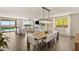 Open-concept living space featuring sleek modern decor, a fireplace, and views of the sparkling pool at 390 Coastal Redwood St, Las Vegas, NV 89138