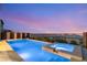 An inviting backyard features a sparkling pool and spa perfect for relaxation and recreation at 390 Coastal Redwood St, Las Vegas, NV 89138