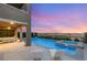 Backyard featuring a covered patio, pool, and spa, perfect for outdoor entertaining at 390 Coastal Redwood St, Las Vegas, NV 89138