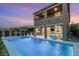 A luxury home featuring a private pool with water fountains and a covered patio at 390 Coastal Redwood St, Las Vegas, NV 89138