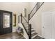 Staircase with contemporary railing, hardwood steps, and a decorative bench at 390 Coastal Redwood St, Las Vegas, NV 89138