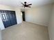Large bedroom features two windows with blinds, a ceiling fan, and carpet flooring at 3938 E Chaffe Ave, Pahrump, NV 89061