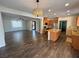 Bright and airy open floor plan living room that connects to the modern kitchen and dining area at 3938 E Chaffe Ave, Pahrump, NV 89061