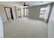 Expansive main bedroom with large windows, carpet flooring, and walk-in closet access at 3938 E Chaffe Ave, Pahrump, NV 89061