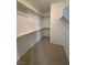 Bright walk-in closet features ample shelving and storage space at 3938 E Chaffe Ave, Pahrump, NV 89061