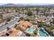 An aerial view showcasing a neighborhood with swimming pools and palm trees in the yards at 3941 Boca Grande Ave, Las Vegas, NV 89120