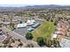 Aerial view featuring a well-maintained school with a large green sports field and parking lot at 3941 Boca Grande Ave, Las Vegas, NV 89120