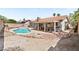 Spacious backyard with a sparkling pool, BBQ area, and low-maintenance landscaping, perfect for outdoor entertaining at 3941 Boca Grande Ave, Las Vegas, NV 89120