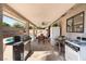 Backyard with a covered patio area that offers outdoor dining and cooking space at 3941 Boca Grande Ave, Las Vegas, NV 89120