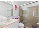 Bathroom showcasing a glass-enclosed shower and a single sink vanity at 3941 Boca Grande Ave, Las Vegas, NV 89120