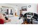 Bedroom with a treadmill, teddy bear and mirrored closet at 3941 Boca Grande Ave, Las Vegas, NV 89120