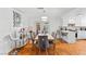 Elegant dining room with modern lighting, stylish decor, and wood floors, perfect for entertaining at 3941 Boca Grande Ave, Las Vegas, NV 89120
