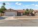 Charming single-story home featuring a well-maintained front yard and a two-car garage at 3941 Boca Grande Ave, Las Vegas, NV 89120