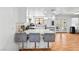 Bright kitchen with breakfast bar flows into the dining area in this open floor plan at 3941 Boca Grande Ave, Las Vegas, NV 89120
