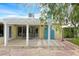 Covered back patio perfect for entertaining, along with stone landscaping at 3989 Parkhaven Dr, Las Vegas, NV 89120
