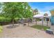 The backyard features a small lawn, swing, and shade at 3989 Parkhaven Dr, Las Vegas, NV 89120
