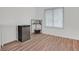 An additional bedroom with wood floors is brightly lit by a large window at 3989 Parkhaven Dr, Las Vegas, NV 89120