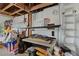 Well-lit garage featuring exposed wood beams and ample storage solutions at 3989 Parkhaven Dr, Las Vegas, NV 89120