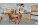 Kitchen and breakfast nook with hardwood table, stainless steel appliances and tile floors at 3989 Parkhaven Dr, Las Vegas, NV 89120