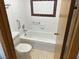 A pristine bathroom featuring a clean white tub and accessible grab bars for safety at 4121 Gannet Cir # 414, Las Vegas, NV 89103