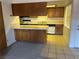 Cozy kitchen featuring wooden cabinets, ample counter space, and modern appliances at 4121 Gannet Cir # 414, Las Vegas, NV 89103