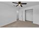 Neutral bedroom with carpet, fan, closet and doorway; bright and spacious at 4186 Toronto Cir, Las Vegas, NV 89121