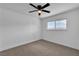 Clean, carpeted bedroom with a ceiling fan and a window view of mountains at 4186 Toronto Cir, Las Vegas, NV 89121