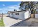 Charming single-story home with a white exterior, carport, and a well-maintained yard at 4186 Toronto Cir, Las Vegas, NV 89121