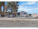 Charming home featuring a white picket fence, mature trees, and a well-maintained yard at 4186 Toronto Cir, Las Vegas, NV 89121