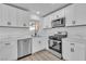 Contemporary kitchen featuring modern appliances, white cabinets, and white countertops at 4186 Toronto Cir, Las Vegas, NV 89121