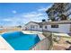 Backyard view featuring a swimming pool, landscaped area, and the home's exterior at 4186 Toronto Cir, Las Vegas, NV 89121