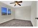 This bedroom has carpet flooring, a ceiling fan and a window at 433 Sellers Pl, Henderson, NV 89011