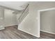 Open-concept living room with hardwood floors and a staircase at 433 Sellers Pl, Henderson, NV 89011